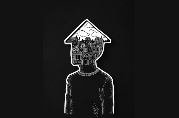 A man with a house-shaped head and thoughts of homes inside the head